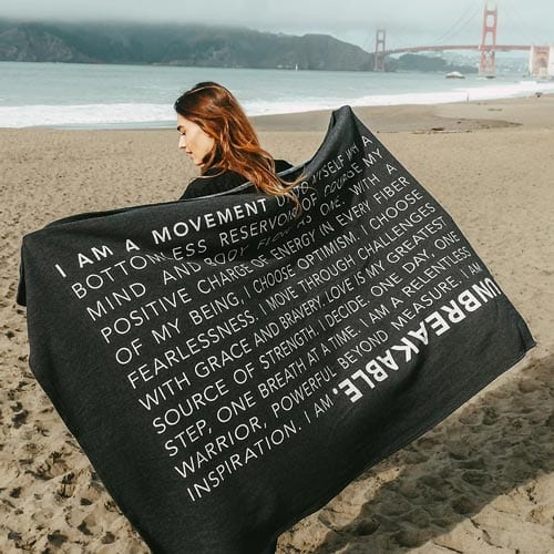 Mind In Motion “Unbreakable” fleece blanket with inspirational message