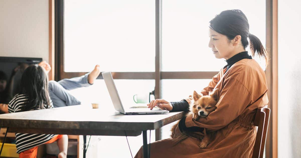 Asian business woman multitasking while working from home