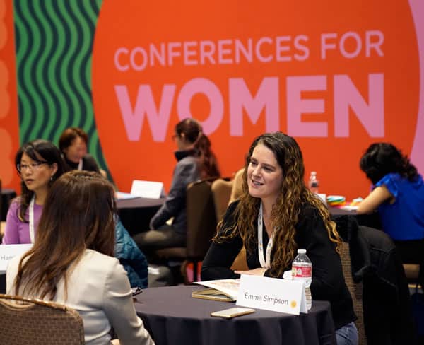 attendees getting their resumes reviewed at the 2023 CA Conference for Women